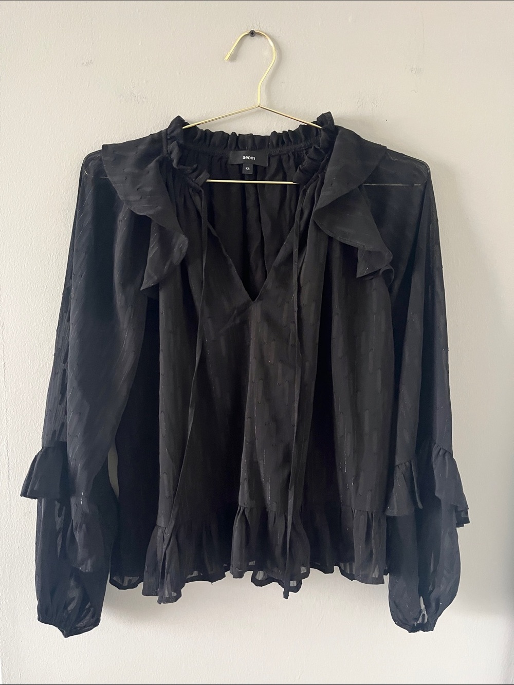 Aeom Black Ruffle-Trim Semi-Sheer Blouse